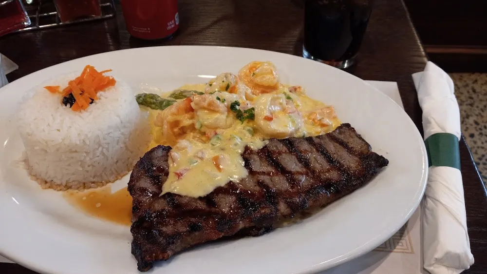 Grilled Sirloin Steak and Shrimp and Cream Sauce with Rice and Asparagus